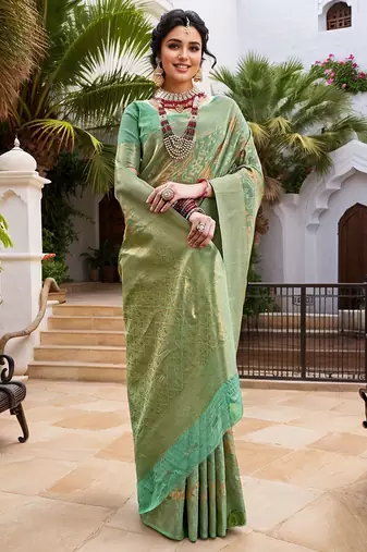 Green woven design zari chanderi saree with blouse piece