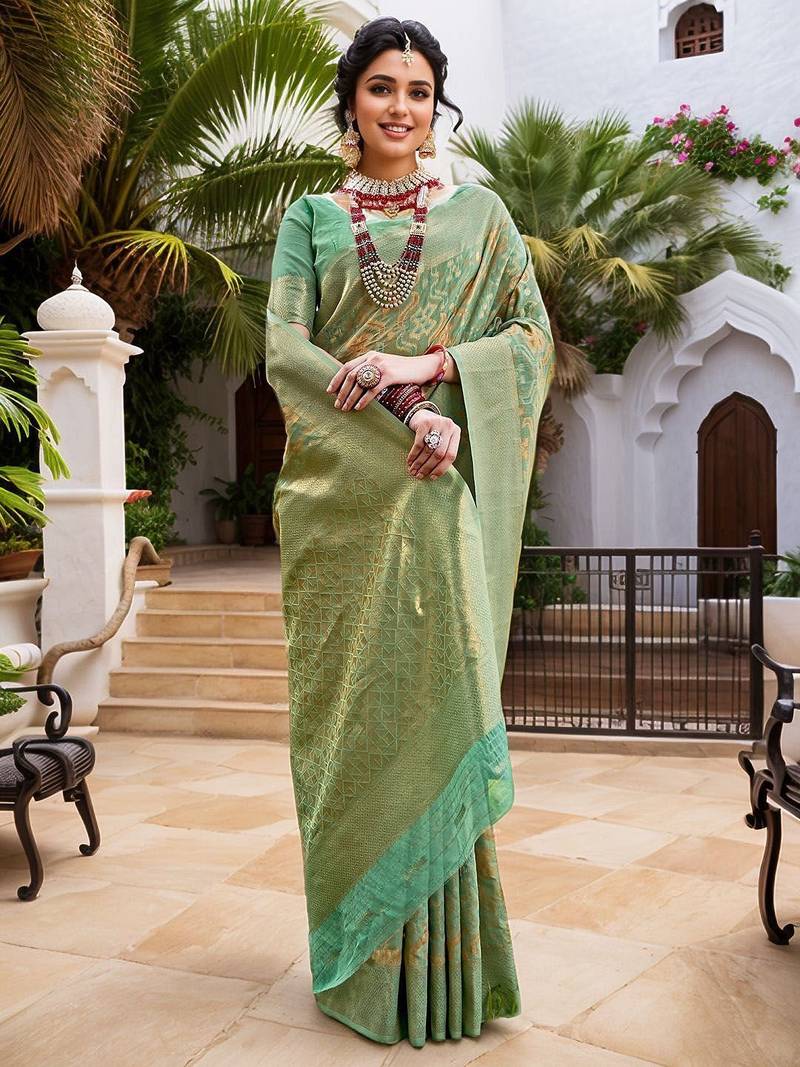 Green woven design zari chanderi saree with blouse piece