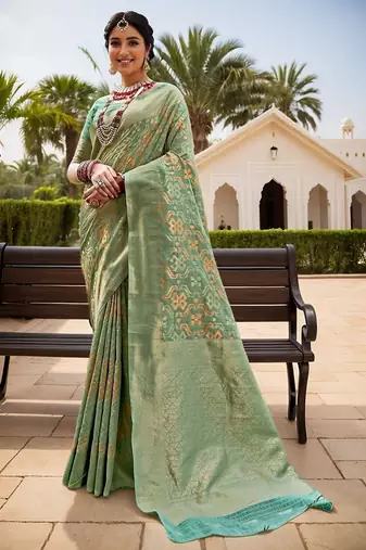 Green woven design zari chanderi saree with blouse piece