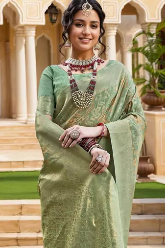 Green woven design zari chanderi saree with blouse piece