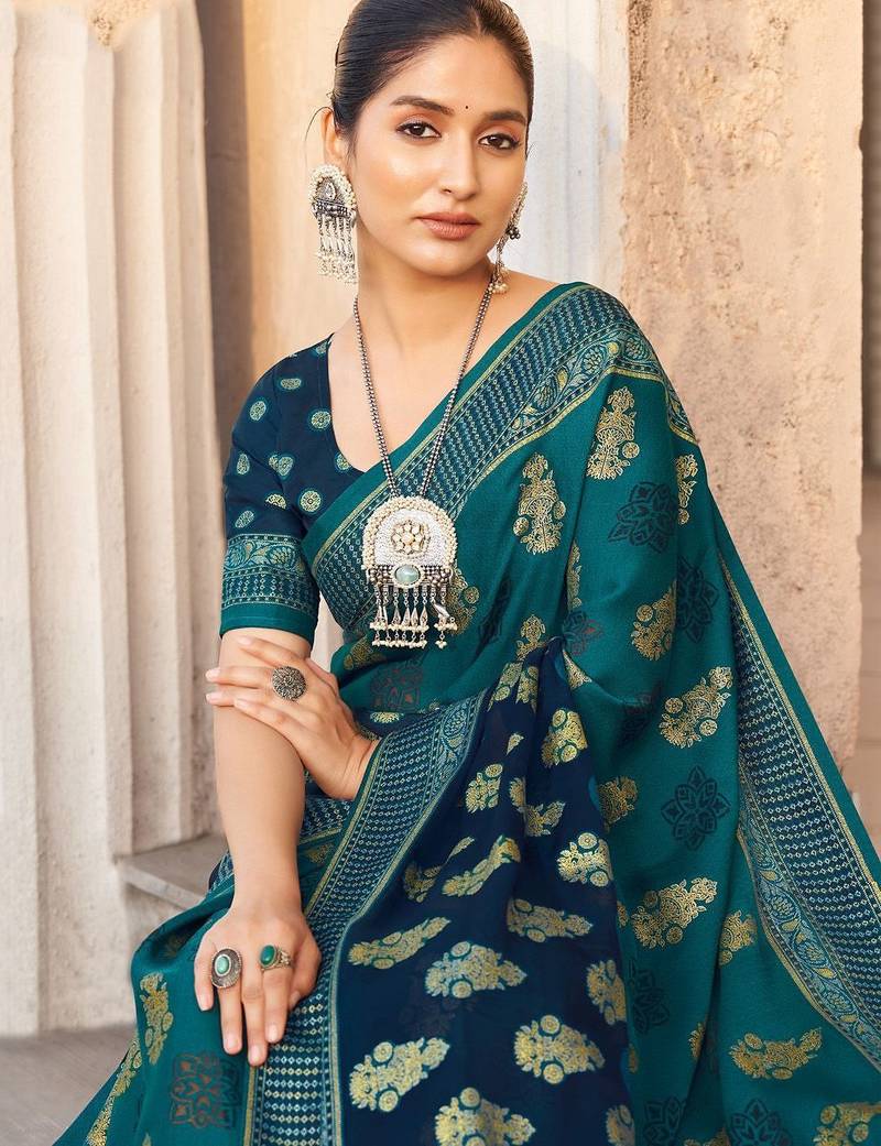 Teal ethnic motifs zari poly georgette saree
