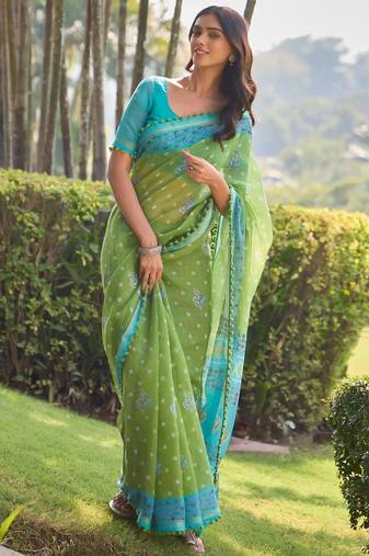 Green ethnic motifs printed saree