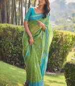 Green ethnic motifs printed saree