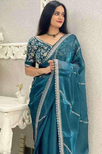 Teal ethnic motifs embroidered organza saree