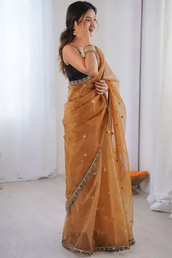 Gold embellished sequinned net designer saree