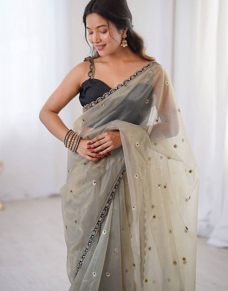 Cream embellished sequinned net designer saree