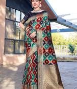 Blue woven design ethnic motifs printed zari organza saree