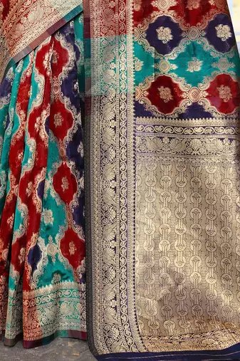 Blue woven design ethnic motifs printed zari organza saree
