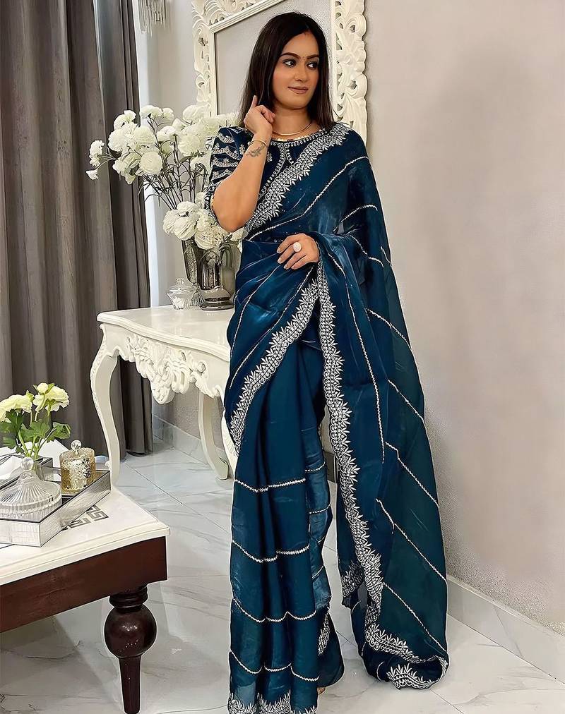 Teal women embellished embroidered saree