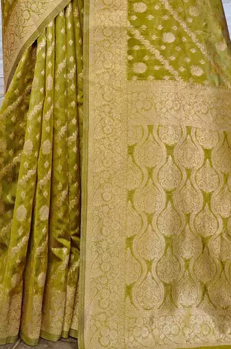 Lime lime green ethnic motifs woven design zari organza saree
