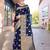 Navy blue ethnic motifs woven design zari detailed organza saree