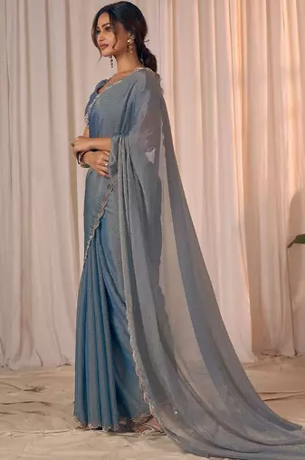 Blue women embellished beads and stones georgette saree