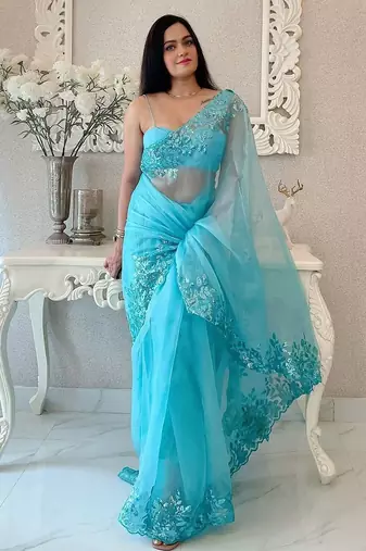 Turquoise floral embellished organza saree