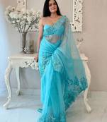 Turquoise floral embellished organza saree