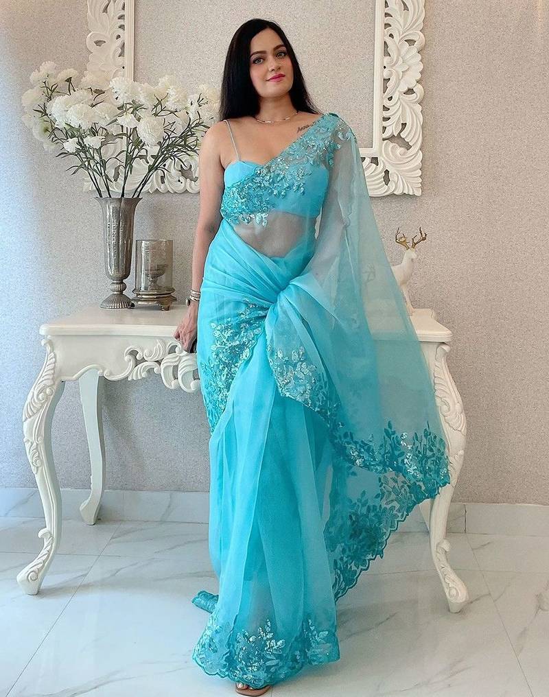 Turquoise floral embellished organza saree