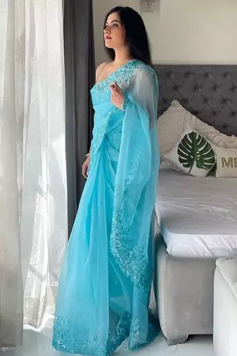 Turquoise floral embellished organza saree