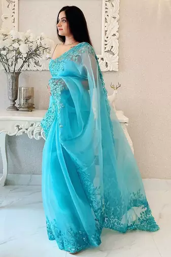 Turquoise floral embellished organza saree
