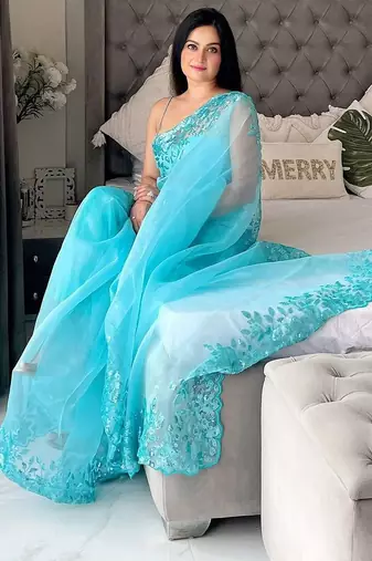 Turquoise floral embellished organza saree