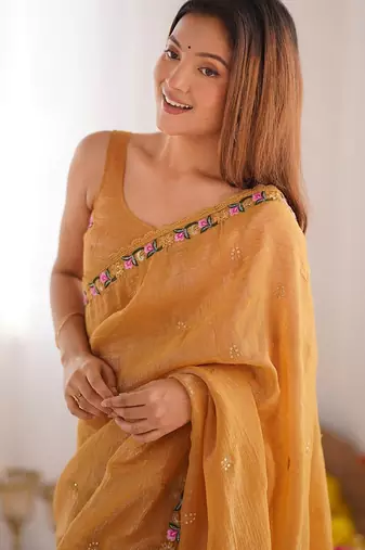 Mustard floral embroidered sequinned tissue saree
