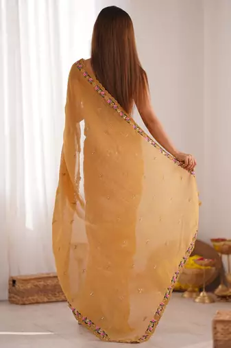 Mustard floral embroidered sequinned tissue saree
