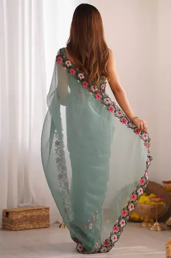 Sea green solid embroidered tissue saree