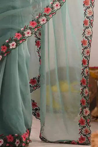 Sea green solid embroidered tissue saree