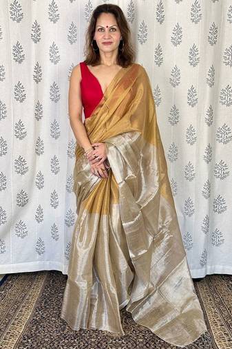Beige zari border tissue kasavu saree with blouse piece