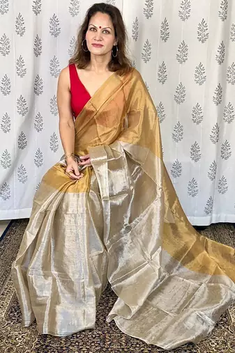 Beige zari border tissue kasavu saree with blouse piece