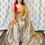 Beige zari border tissue kasavu saree with blouse piece