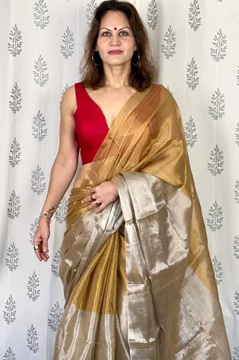 Beige zari border tissue kasavu saree with blouse piece