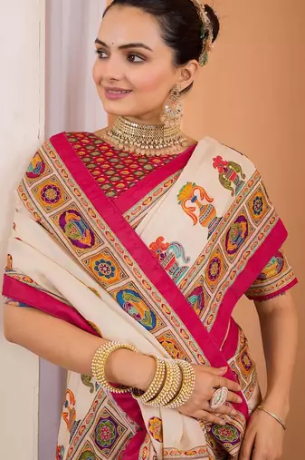 Cream ethnic motifs silk blend saree