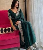 Green embroidered border saree