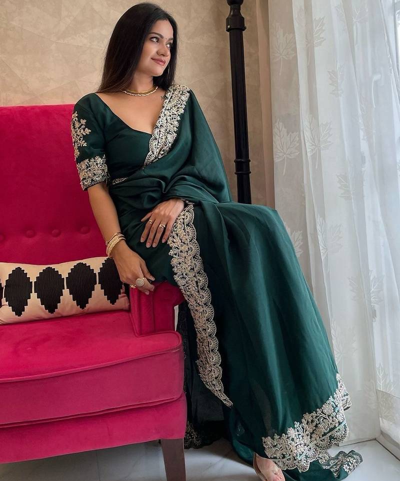 Green embroidered border saree
