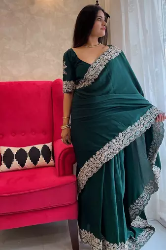 Green embroidered border saree