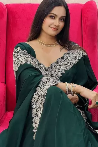 Green embroidered border saree