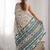 Cream printed mirror work embellished border saree