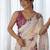 Cream floral printed embroidered mirror work saree