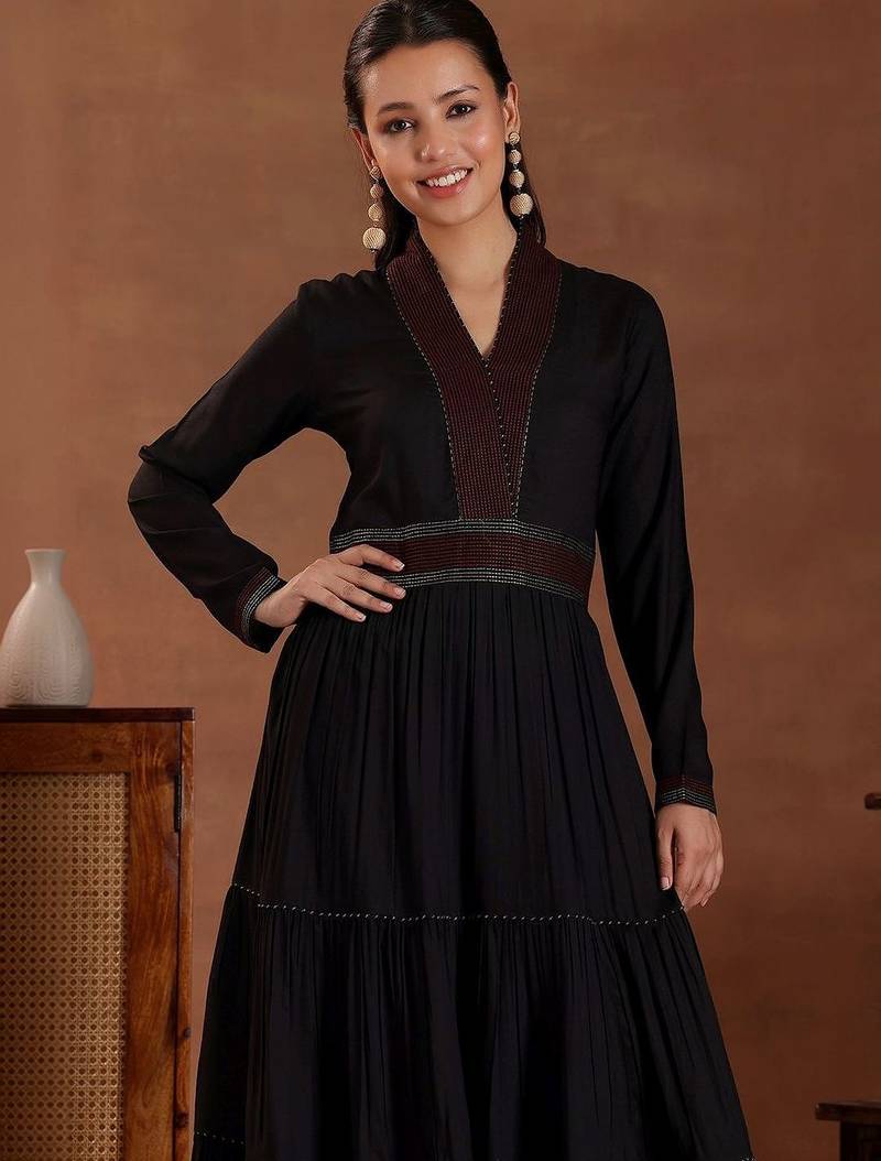 women tiered thread work kurta with trousers