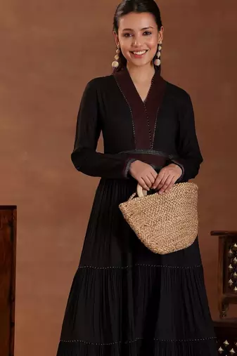 women tiered thread work kurta with trousers