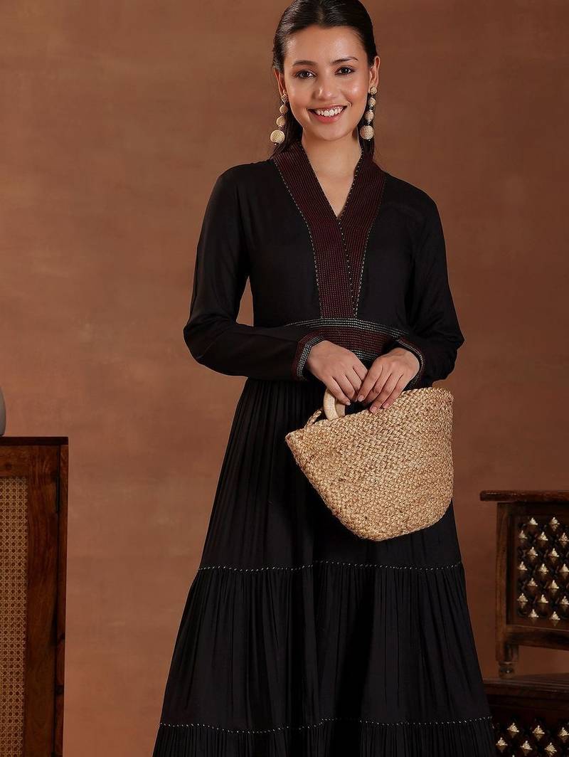 women tiered thread work kurta with trousers