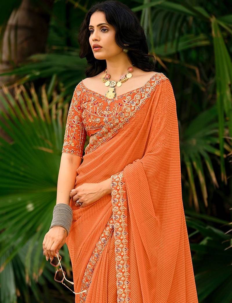 Orange striped printed sequinned  georgette saree