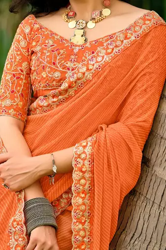 Orange striped printed sequinned  georgette saree