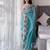 Teal floral embroidered organza saree