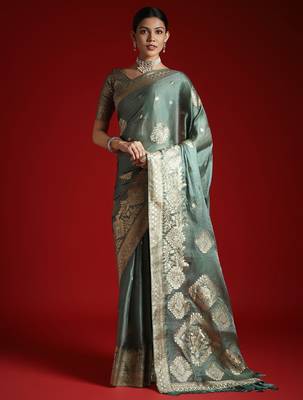 Green ethnic motifs woven design satin banarasi saree 1