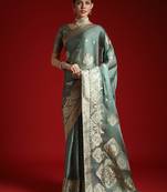 Green ethnic motifs woven design satin banarasi saree
