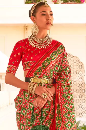 Red ethnic motifs printed zari ikat saree