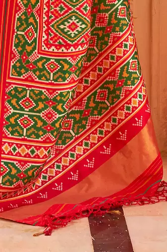 Red ethnic motifs printed zari ikat saree