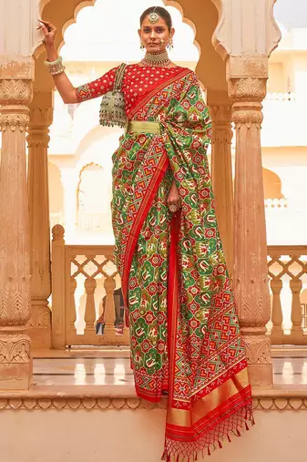 Green ethnic motifs printed zari ikat saree