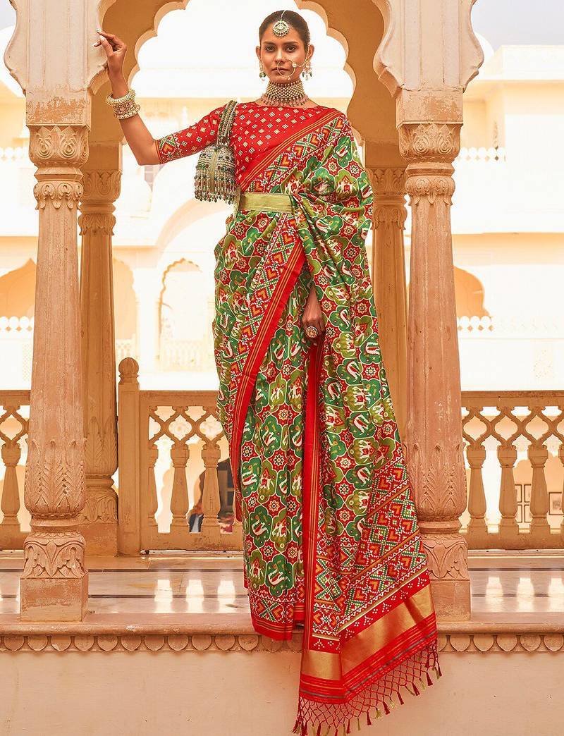 Green ethnic motifs printed zari ikat saree
