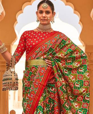 Green ethnic motifs printed zari ikat saree 2